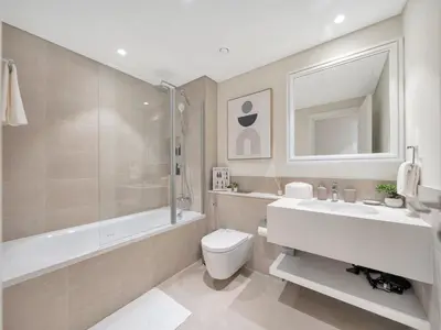 a bathroom with a toilet and a sink and a shower at Palm and Marina Views in NEW Palace Beach Residence in Dubai