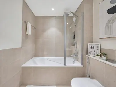 a bathroom with a tub and a shower and a toilet at Palm and Marina Views in NEW Palace Beach Residence in Dubai