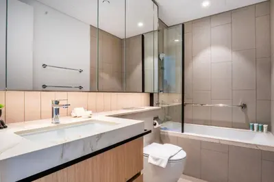 a bathroom with a sink and a toilet and a tub at NEW 2 Bed w Rooftop Pool Panoramic Dubai Views in Dubai