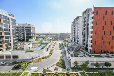 an aerial view of a city with tall buildings at Modern Cozy 1BR Retreat Azizi Riviera Dubai in Dubai