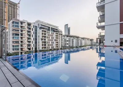 a pool of water in a city with buildings at Luxury Upgraded Studio in Wilton Park Residences in Dubai