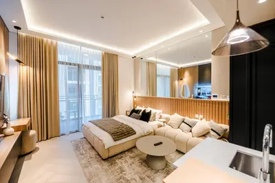 a living room with a bed and a couch at Luxury Upgraded Studio in Wilton Park Residences in Dubai