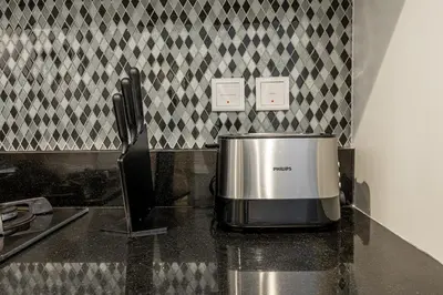 a microwave sitting on a counter in a kitchen at Luxury Penthouse - Scenic View - Near Burj Khalifa in Dubai