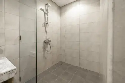 a shower with a glass door in a bathroom at Luxury Penthouse - Scenic View - Near Burj Khalifa in Dubai