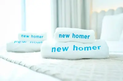 three pillows with the words new home and new home at Private jacuzzi Canal View Infinity Pool in Dubai
