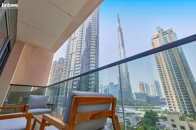 a balcony with chairs and a view of the city at bnbmehomes - Act One Tower in Dubai