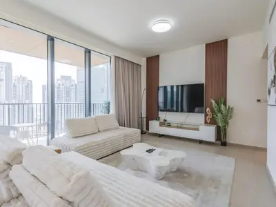 a living room with a couch and a table at TRPS - BLVD Heights, Downtown Dubai - Luxury 1BR, Close to Dubai Mall in Dubai