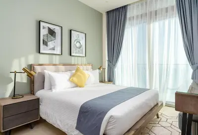 a bedroom with a bed and a large window at Vacay Lettings - Marina Gate 2 in Sabkhah
