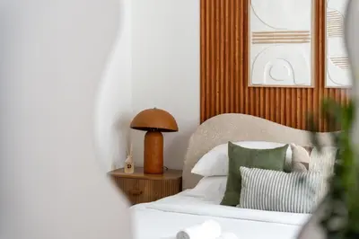 a bedroom with a bed and a lamp on a table at GuestReady - Tasteful home in Dubai Creek Harbour in Dubai