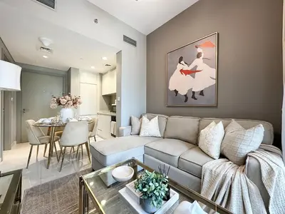 a living room with a couch and a table at Chic 1BR in Business Bay City Views & Upscale Comfort in Dubai
