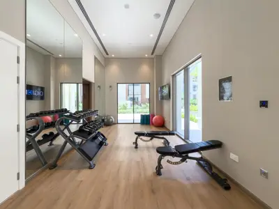 a gym with several exercise bikes in a room at GuestReady - Stylish Stay with Dubai Skyline Views in Dubai