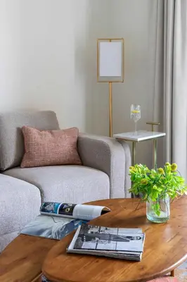 a living room with a couch and a table at Frank Porter - Taraf 2 Residence in Dubai