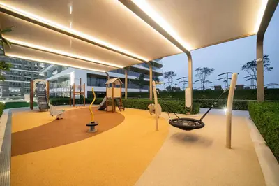 a play area with swings and a playground at Luxury Oasis | Private Beach & Infinity Pool in Dubai