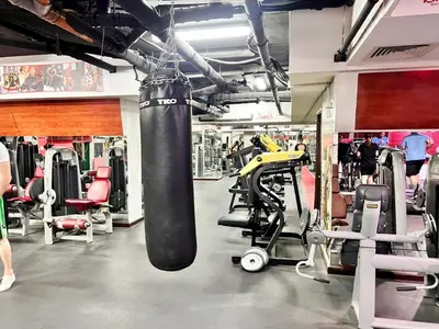 a gym with a punching bag hanging from the ceiling at Best Solo Room in Barsha heights Tecom in Dubai