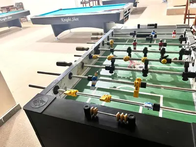 a row of pool tables in a room at Best Solo Room in Barsha heights Tecom in Dubai