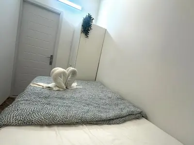 a room with a bed with two stuffed animals on it at Best Solo Room in Barsha heights Tecom in Dubai
