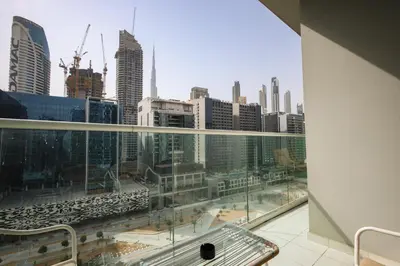 a view of a city skyline from a building at Comfy 1BR with Large Balcony - 15-min to Mall & Burj in Dubai