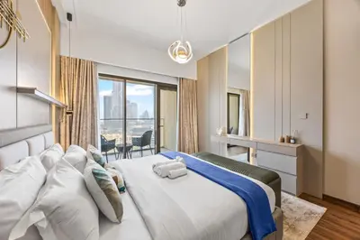a bedroom with a large bed with a large window at 2BR Burj Khalifa Dubai Mall View in Dubai