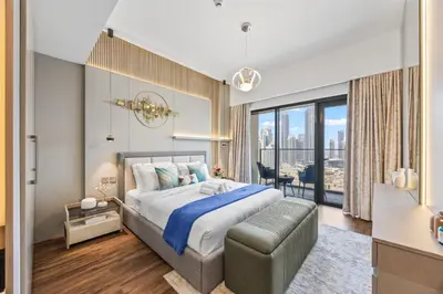 a bedroom with a large bed and a large window at 2BR Burj Khalifa Dubai Mall View in Dubai