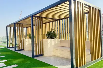 a pavilion with plants in it on a building at Canal View Studio Jacuzzi in Dubai