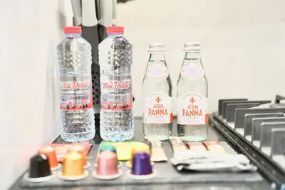 a group of bottles of water in a refrigerator at Canal View Studio Jacuzzi in Dubai