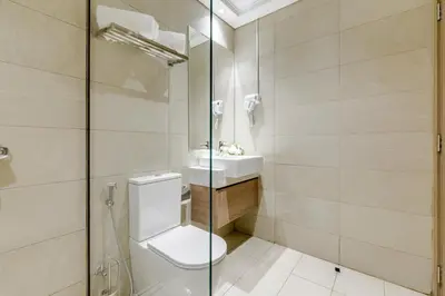 a bathroom with a toilet and a sink at GLOBALSTAY Elegant Meydan Apartments - Azizi Riviera 40 in Dubai