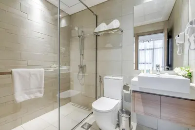 a bathroom with a toilet and a sink and a shower at GLOBALSTAY Elegant Meydan Apartments - Azizi Riviera 40 in Dubai