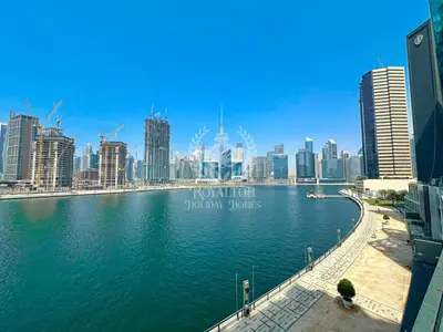 a view of a city with a body of water at Royalton - Cozy Studio with Burj Khalifa & Canal Views in Dubai