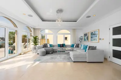 a living room with a couch and a table at Maison Privee - Ultra-Luxury Villa with Private Pool & Beach on Palm in Dubai