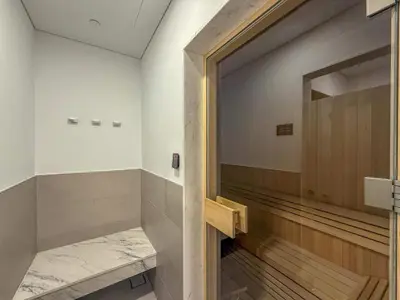 a bowling alley with a door to a game room at Frank Porter - Kensington Waters, Sobha Hartland in Dubai