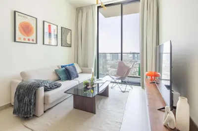 a living room with a couch and a table at Frank Porter - Binghatti Tulip in Dubai