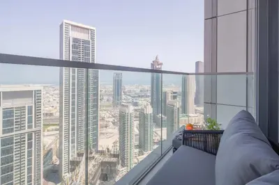 a room with a view of a city with tall buildings at Frank Porter - Grande Signature Residences in Dubai