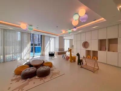 a large living room with a table and chairs at Frank Porter - Grande Signature Residences in Dubai