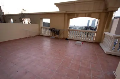 a room with a balcony with a tile floor at Must update to luxury studio in heart of marina Dubai in Dubai
