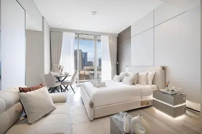 a bedroom with a bed and a living room at LUXE Rooftop Infinity Pool 5 Mins to JBR Dubai Marina View in Dubai