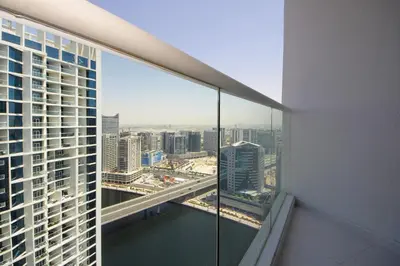 a view of a city from a window in a building at Stylish Damac Prive Studio on hghFlr with Canal View in Dubai