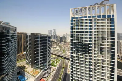 an aerial view of a city with tall buildings at Stylish Damac Prive Studio on hghFlr with Canal View in Dubai