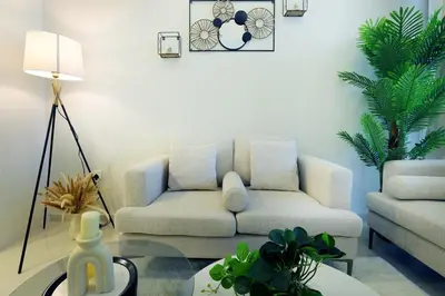 a living room with a couch and a table at 2BR I Aykon City I Business Bay I Bshh in Dubai