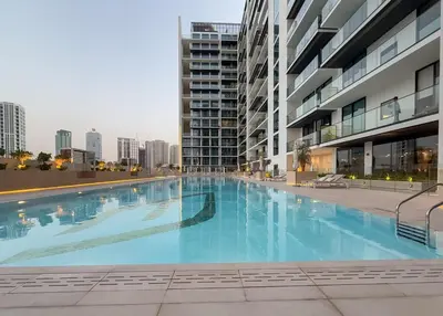 a large swimming pool in the middle of a building at Luxury 1BR Apt Binghatti Amber Prime Location in Dubai