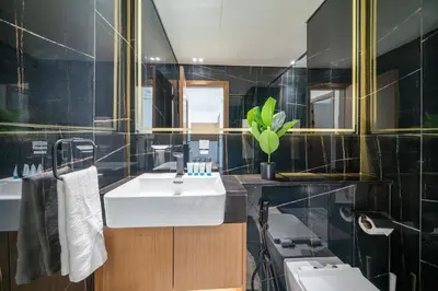 a bathroom with a sink and a toilet at Skyline Views from Binghatti House in Dubai