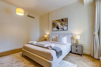 a bedroom with a large bed in a room at Rimal 1 in JBR - 1 Bedroom Apartment - Allsopp & Allsopp in Dubai