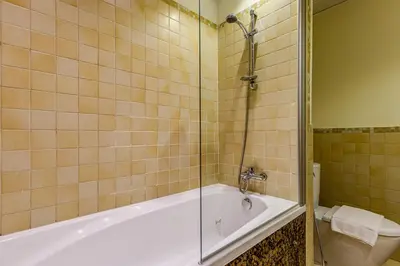 a bathroom with a shower and a tub and a toilet at Rimal 1 in JBR - 1 Bedroom Apartment - Allsopp & Allsopp in Dubai