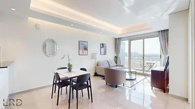 a living room with a table and a couch at Chic & Cozy 1BR in Centurion Onyx in Dubai