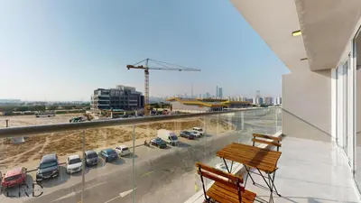 a balcony with a view of a parking lot at Chic & Cozy 1BR in Centurion Onyx in Dubai