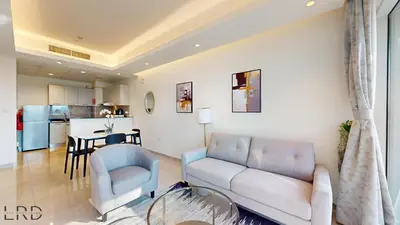 a living room with a couch and a table at Chic & Cozy 1BR in Centurion Onyx in Dubai