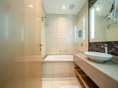 a bathroom with a sink and a bath tub at Elegant 2 Bedroom Apartment with Pool Views at Business Bay 211DPA-2 in Dubai