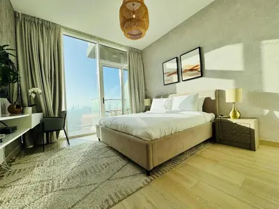 a bedroom with a bed and a large window at Sky-High Studio Marina Skyline View Bloom Tower in Dubai