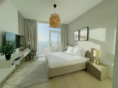 a bedroom with a white bed and a large window at Sky-High Studio Marina Skyline View Bloom Tower in Dubai