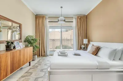 a bedroom with a large white bed and a window at DAYF-BVE Large 1BR in Downtown Steps to Dubai Mall in Dubai