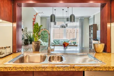 a kitchen with a stainless steel sink in a kitchen at DAYF-BVE Large 1BR in Downtown Steps to Dubai Mall in Dubai